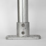 Uni‑Fit base plate with welded cup securing vertical post on solid surface