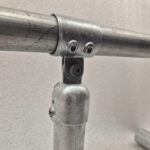 Uni‑Fit Cup with Bolt connector securing horizontal rail to upright barrier post