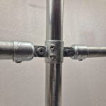 Uni‑Fit Two Way Fixed Ring securing horizontal rails to vertical barrier post